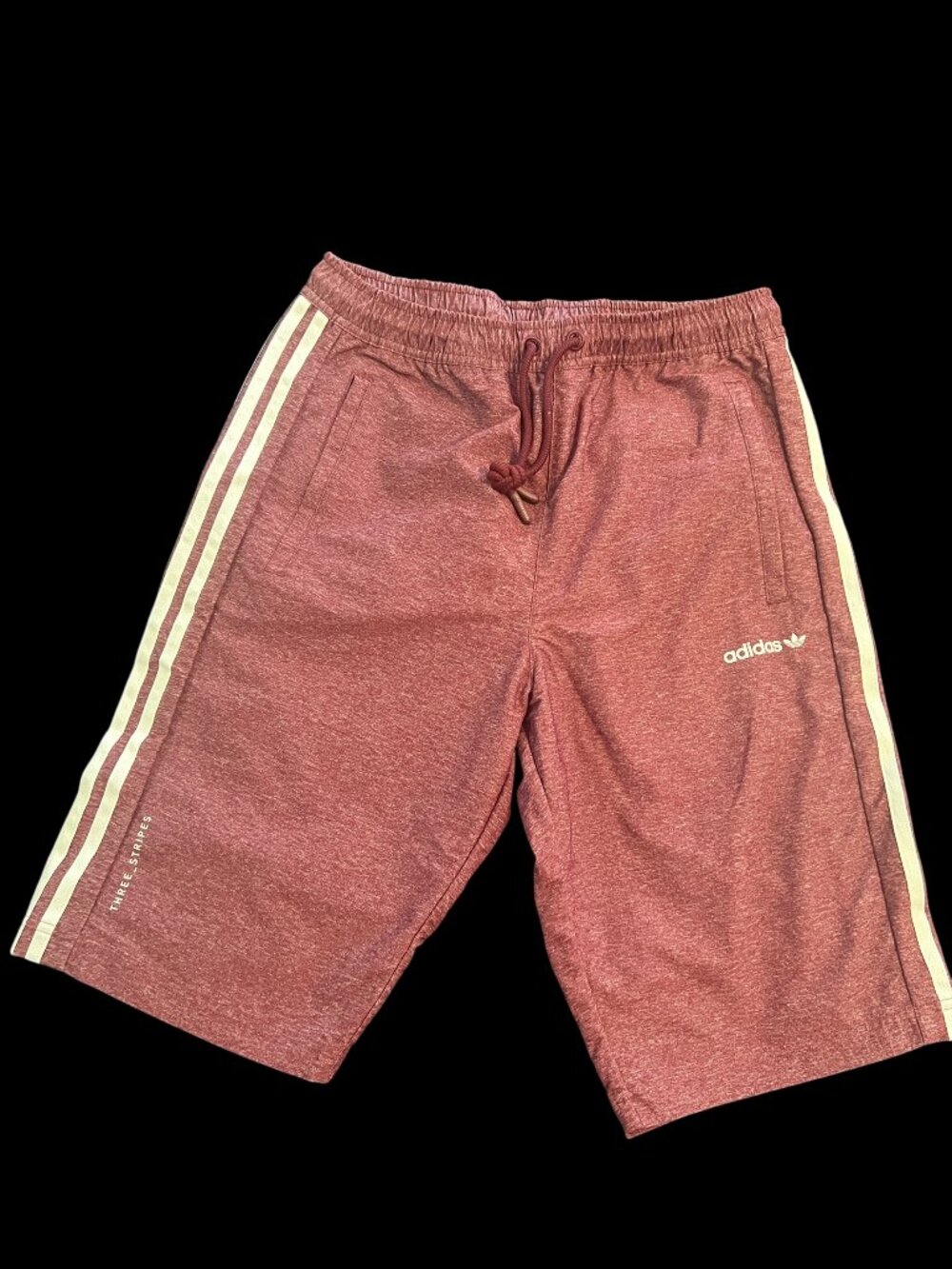NWT Adidas shorts feature a textured, burgundy or "shadow red" heathered knit